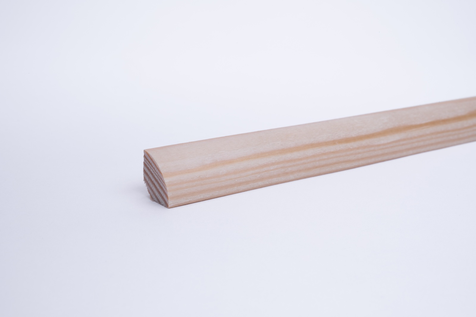 Real wood skirting as quarter round profile pine oiled