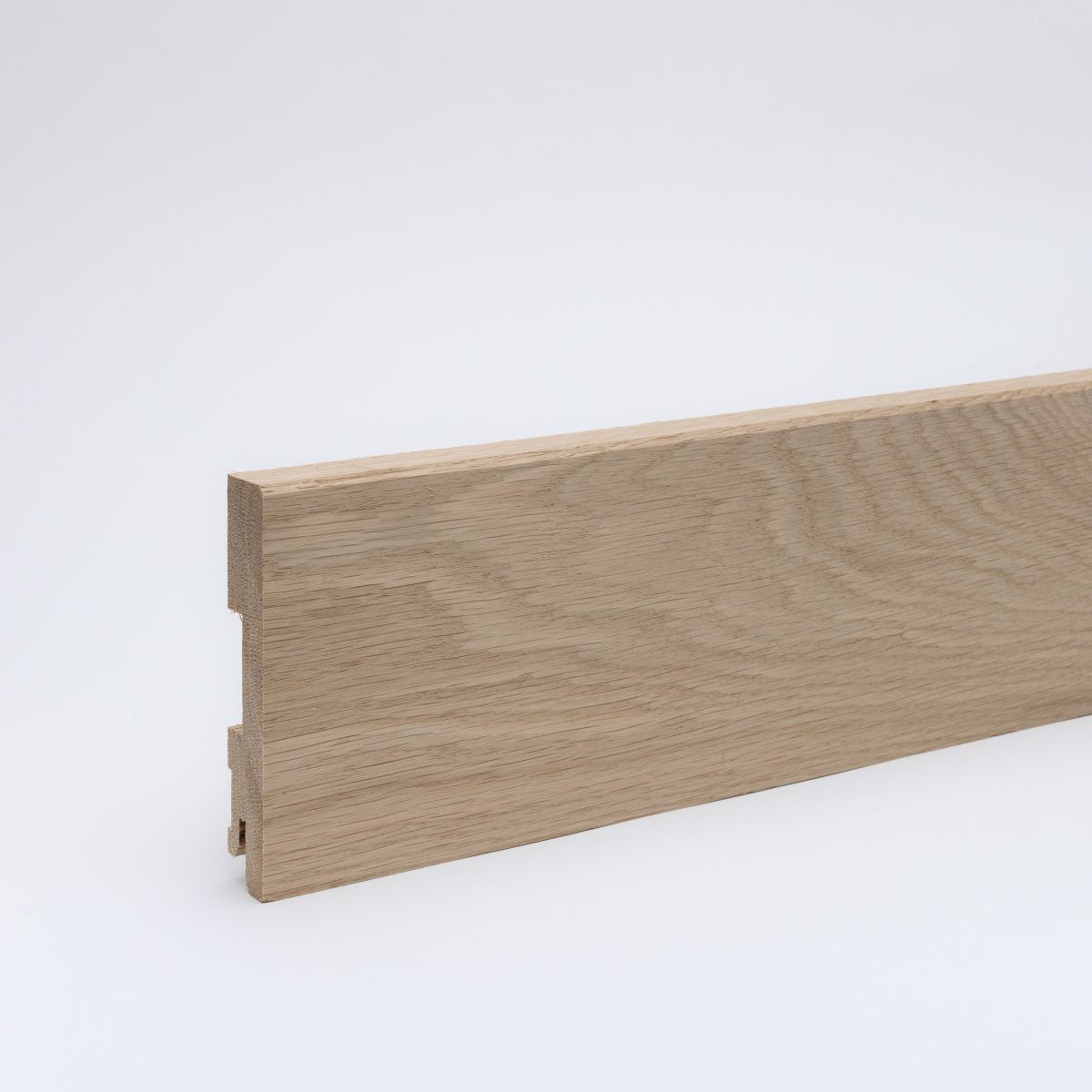 Solid wood skirting board 100mm bevelled front edge - oak raw
