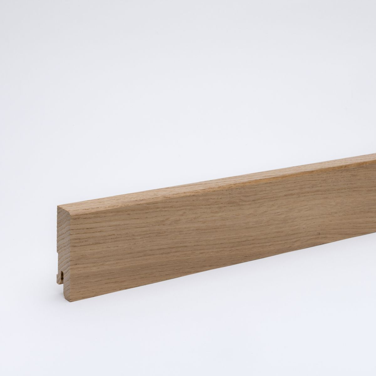 Solid wood skirting board 60x16mm chamfered leading edge  - lacquered oak Solid wood skirting board 60x16mm chamfered leading edge  - lacquered oak