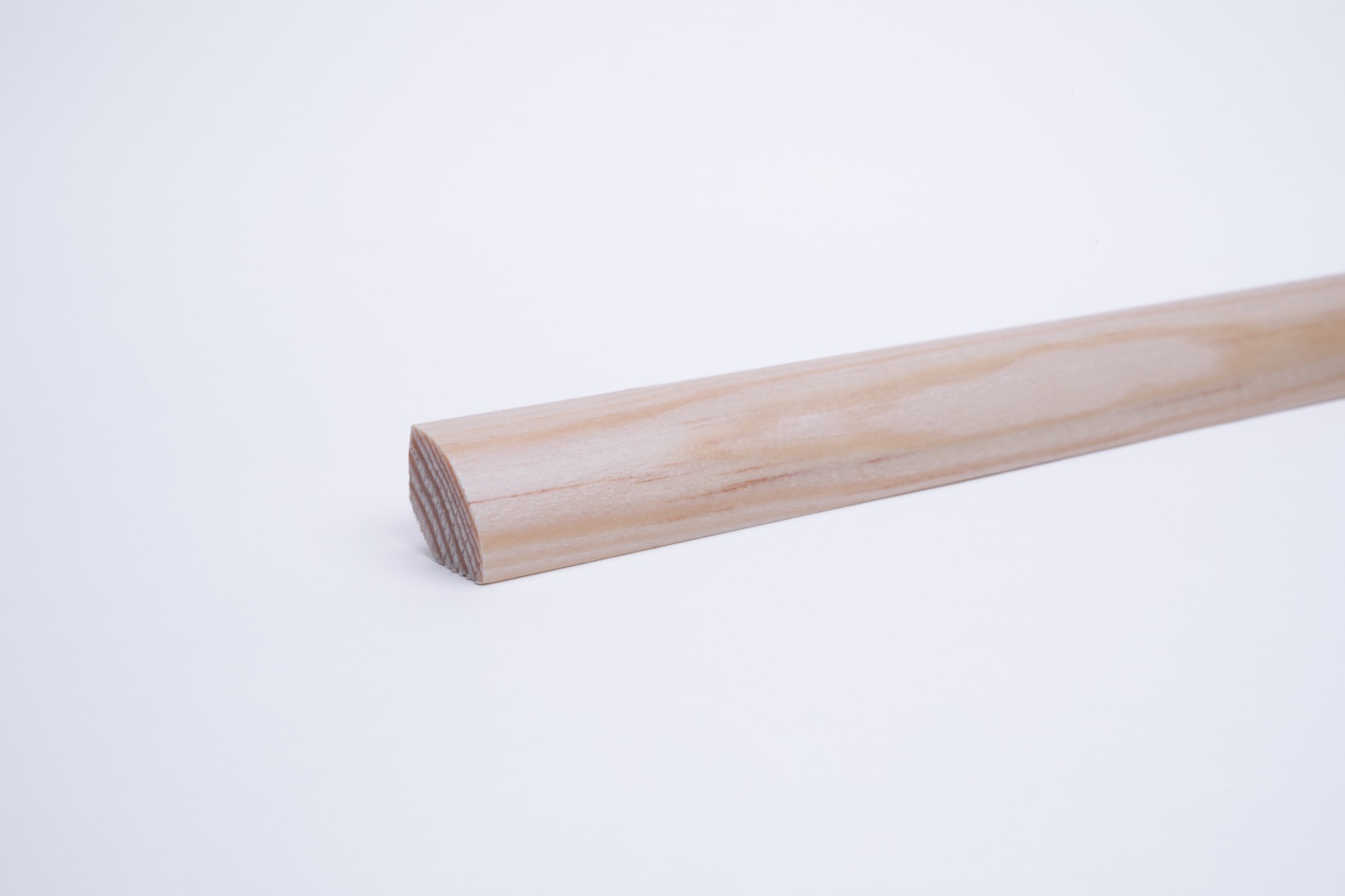 Real wood skirting as quarter round profile pine varnished