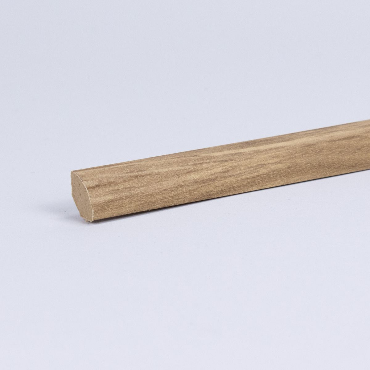 MDF skirting as quarter round profile in wood optics oak MDF skirting as quarter round profile in wood optics oak